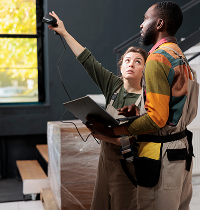 manager scanning packages barcode using store scanner